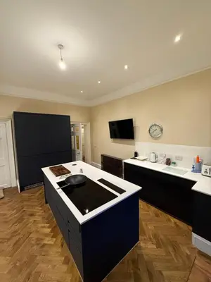 a kitchen with an island in the middle of it at Entire rental in Edinburgh City Centre in Edinburgh