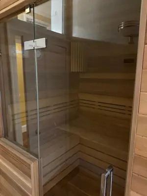 a walk in shower with a glass door at Entire rental in Edinburgh City Centre in Edinburgh