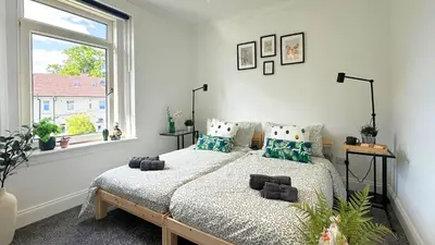 a bedroom with a bed and a window at New quite and comfy home Glasgow in Knightswood