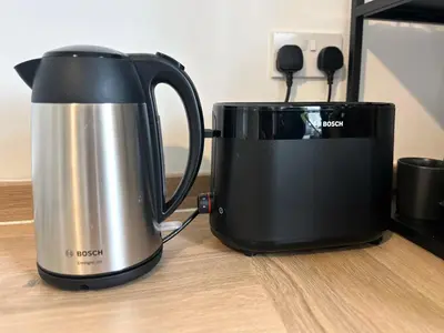 a black and silver appliance sitting on a table at New quite and comfy home Glasgow in Knightswood