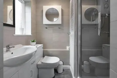 a bathroom with a sink and a toilet and a shower at Riverside City Apartment in Glasgow