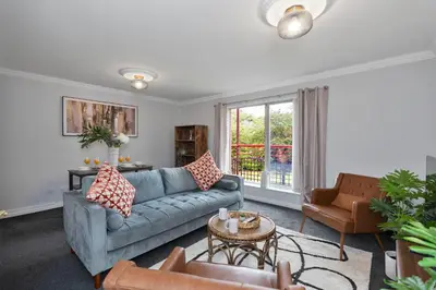 a living room with a couch and a table at Riverside City Apartment in Glasgow
