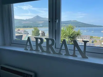 a window with the word arama in front of it at Grey Gables Cottage, Brodick, Isle of Arran, Scotland in Isle of Arran