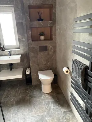 a bathroom with a toilet and a sink at The Wee Bothy in Oban