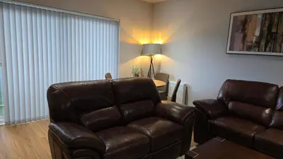 a living room with a couch and a chair at ANSI Splendor in Livingston