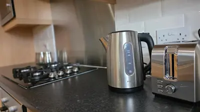 a coffeemaker sitting on top of a kitchen counter at ANSI Splendor in Livingston