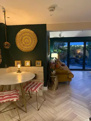 a living room with a table and a couch at The Rookery in Moffat