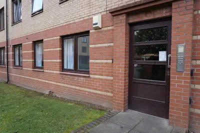 a brick building with a door on the side of it at Glasgow Group Getaway in Glasgow