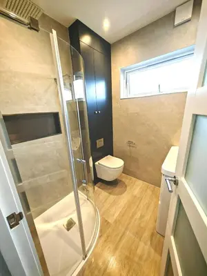 a bathroom with a shower and a toilet at Cozy corner 2 bedroom house in Edinburgh