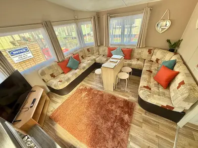 an overhead view of a living room with a couch at Deluxe Delta 4-Bedroom Caravan Located at Maryville Caravan Site Uddingston, Glasgow in Uddingston