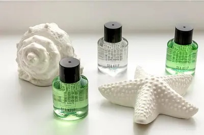 a group of three bottles of soap and a starfish at Castle Street Apartments - Luxury Kerrycroy Ground Floor Apartment in Rothesay