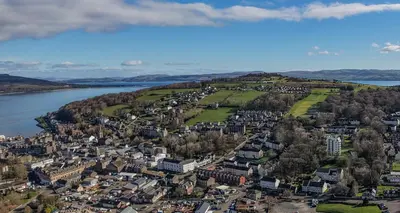 an aerial view of a city next to the water at Castle Street Apartments - Luxury Kerrycroy Ground Floor Apartment in Rothesay