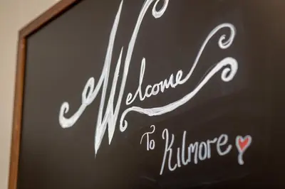 a chalkboard with a sign that says welcome to kirribilli at Kilmore Paws and Relax in Comrie