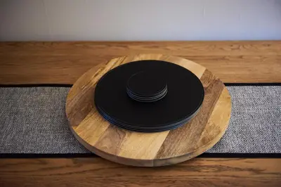 a black hat sitting on top of a wooden table at Luxury Old Town Apartment just a 5 Minute Walk to Stirling Castle in Stirling