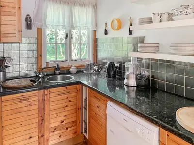 a kitchen with a sink and a counter top at Tigh An Droma Lodge in Whiting Bay