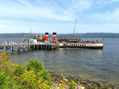 a large boat on the water near a dock at Thornlie - Uk49875 in Blairmore
