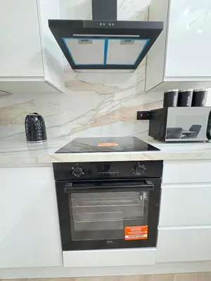 a kitchen with a stove top oven in a counter at 3BR West End Flat w Free Parkin in Glasgow