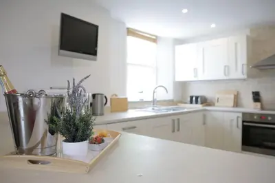 a kitchen with a counter with a tray with plants on it at Loch Tay, Estate House with Panoramic Vistas in Lawers