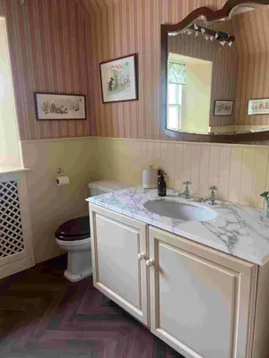 a bathroom with a sink and a toilet at Fordie Lodge in Comrie