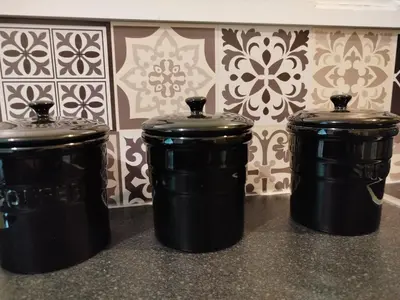three black trash cans sitting on a counter in a kitchen at Lovely flat in Gorgie, Edinburgh in Edinburgh