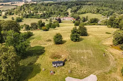 an aerial view of a house in a field at Redwood in Moffat