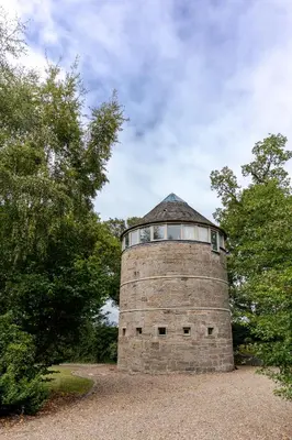 a brick tower with a window on top of it at Retreat to the Water Tower in Queensferry