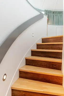 a staircase with wood treads in a house at Retreat to the Water Tower in Queensferry