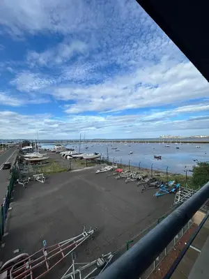 a view of a marina with boats in the water at Waterfront Spacious Flat in Edinburgh