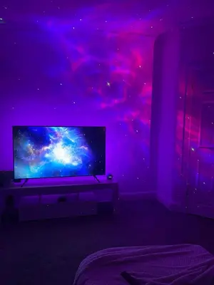 a room with a tv in a purple room at Glasgow City Apartment with 2 Bedrooms in Glasgow