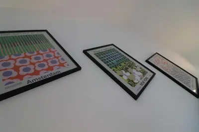 a group of three picture frames on a table at Signature - Hattrix View in Cumbernauld