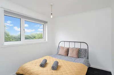 a bedroom with a bed and a window at 3BR Family House with Free Parking in West Lothian in Whitburn