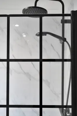 a glass shower with a shower head on top at 3BR Family House with Free Parking in West Lothian in Whitburn