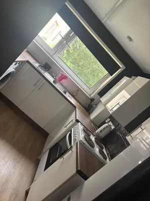 an overhead view of a kitchen with a window at Modern 1 bedroom flat full flat in East Kilbride