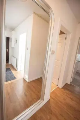 a large mirror in a room with a hallway at Dalziel House-3 bedroom Hamilton in Hamilton