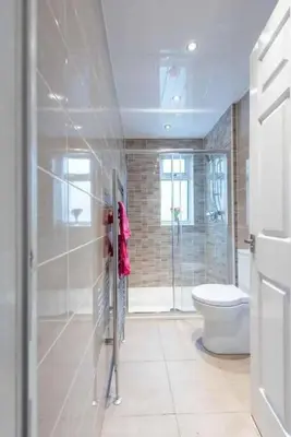 a bathroom with a shower and a toilet in it at Dalziel House-3 bedroom Hamilton in Hamilton