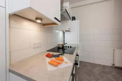 a kitchen with carrots on a cutting board on a counter at Dalziel House-3 bedroom Hamilton in Hamilton