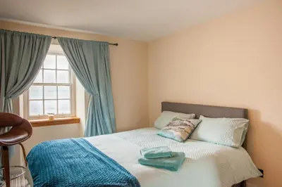 a bedroom with a bed with two towels on it at Lochfyne-View Apartment in Inveraray