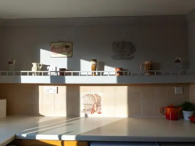 a kitchen with a counter top in a room at 3 Bedroom Home, Peaceful Garden in Edinburgh