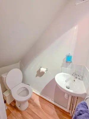 a bathroom with a toilet and a sink at 3 Bedroom Home, Peaceful Garden in Edinburgh