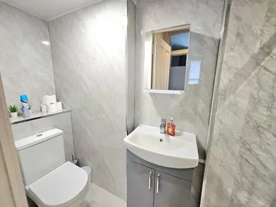 a bathroom with a white toilet and a sink at Sensational Stay- Fountainbridge in Edinburgh