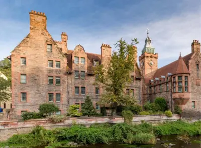 a large brick building with a clock tower on top at Dean Village, Edinburgh in Edinburgh