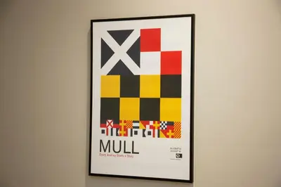 a framed picture of a mill on a wall at Stylish 2Bedroom Flat - Central Oban in Oban