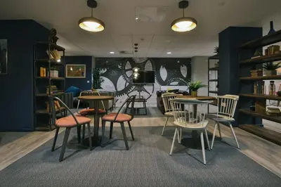 a room with tables and chairs in a library at For Students Only - George Street in Glasgow in Glasgow
