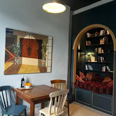 a dining room with a table and chairs and a couch at The Art Apartment in Kirn