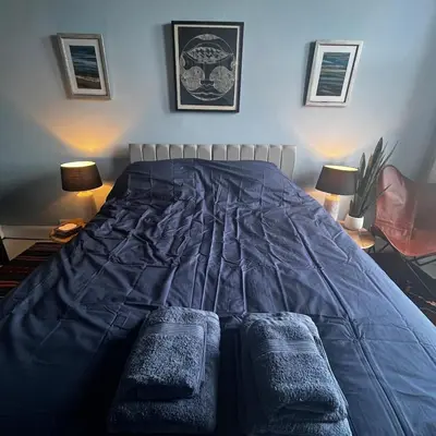 a bed with two pillows on it in a bedroom at The Art Apartment in Kirn