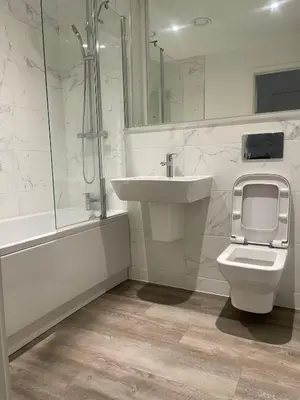 a bathroom with a sink and a toilet and a shower at The Bank Tower in Moffat