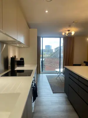 a kitchen with a counter and a large window at The Bank Tower in Moffat