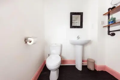 a bathroom with a toilet and a sink at Cosy Central Apartment by the Meadows 11 in Edinburgh