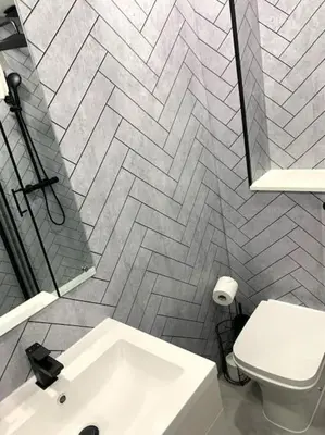 a bathroom with a white sink and a toilet at Grassmarket Apartment in Edinburgh