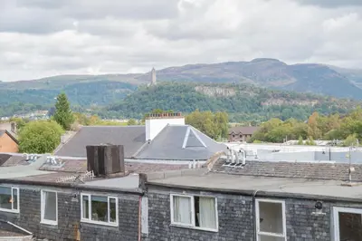a roof of a building with mountains in the background at Banrigh House in Stirling